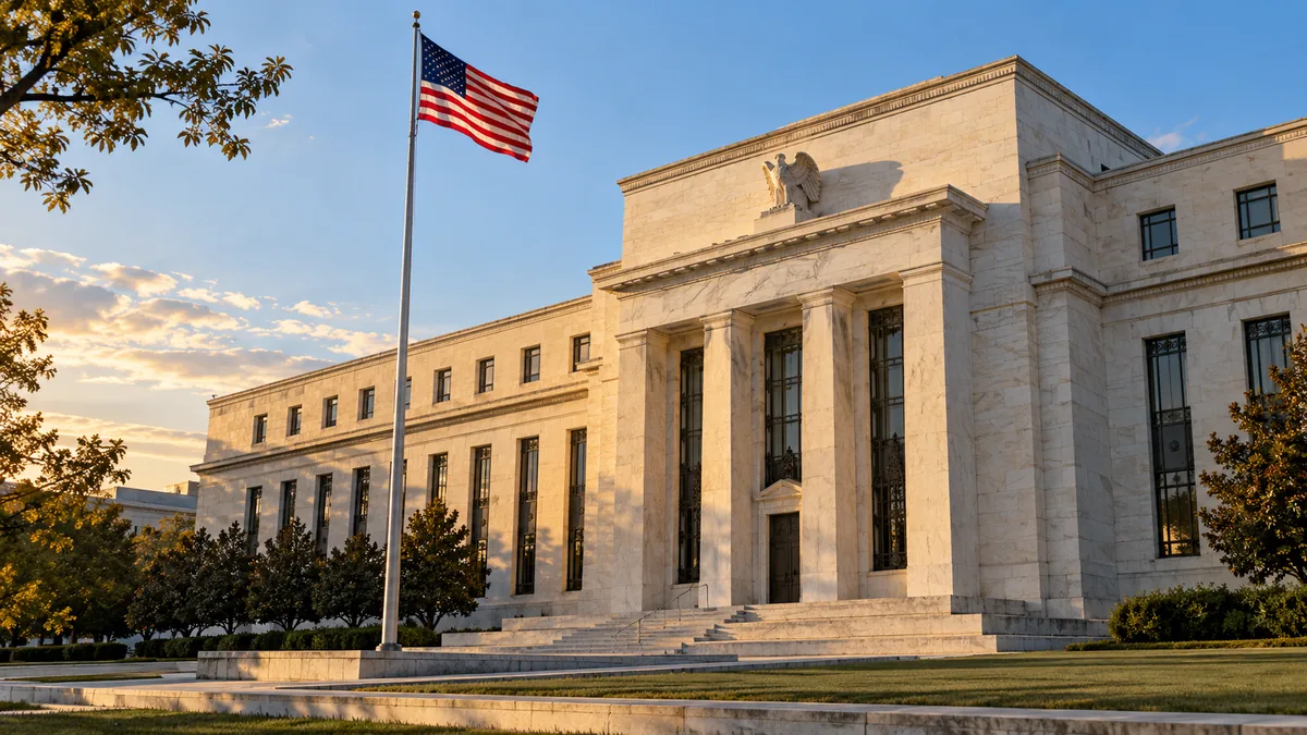 Central-bank building with a stone facade and an American flag